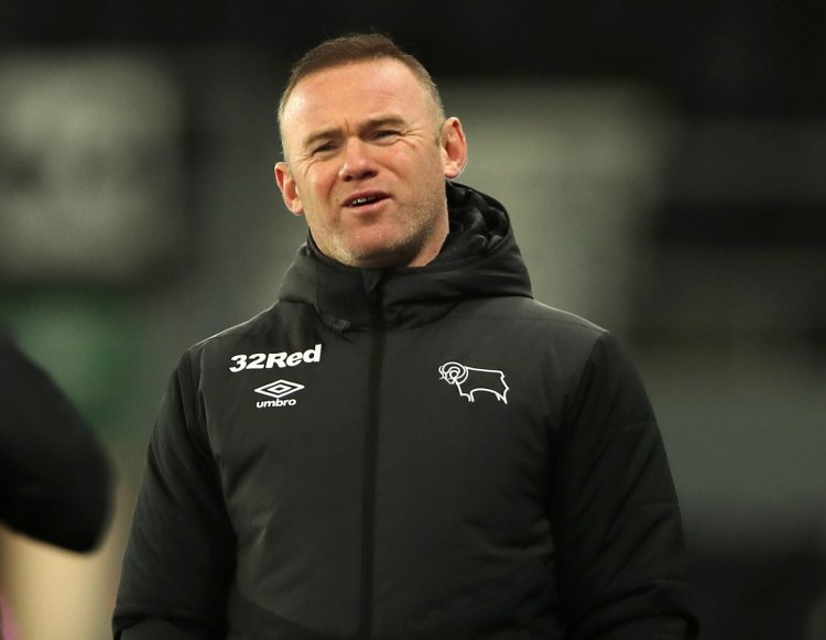 Derby County’s Wayne Rooney reacts to Steven Gerrard’s title success at Rangers