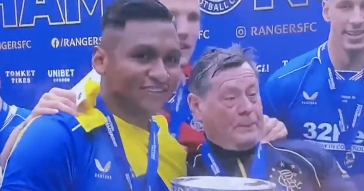 Jimmy Bell pictured with Rangers trophy as kitman gets in on title party