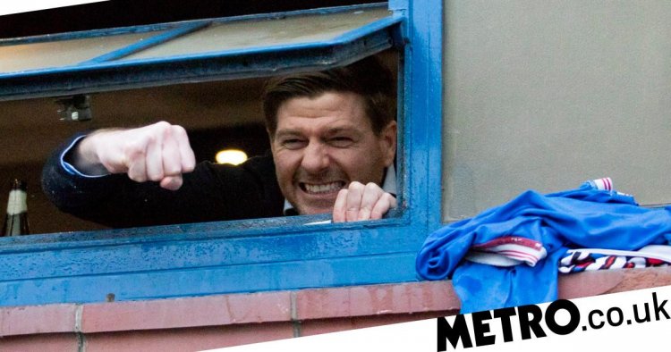Steven Gerrard reacts to being mobbed by Rangers fans outside Ibrox