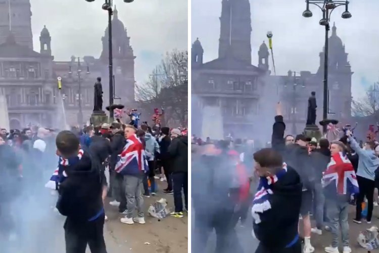 Shocking moment Rangers fan lights firework among group celebrating in George Square