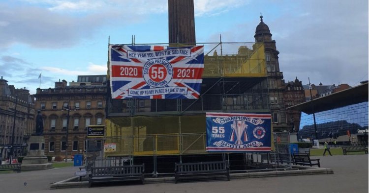 Rangers fans decorate George Square monument with title flags