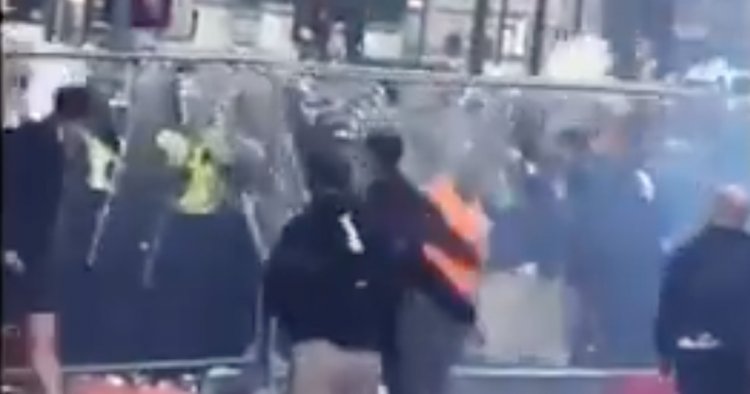 Moment cops are pelted with flares and missiles during Rangers fan celebrations