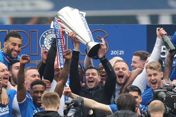 Like father, like son. Gerrard Jr with the trophy